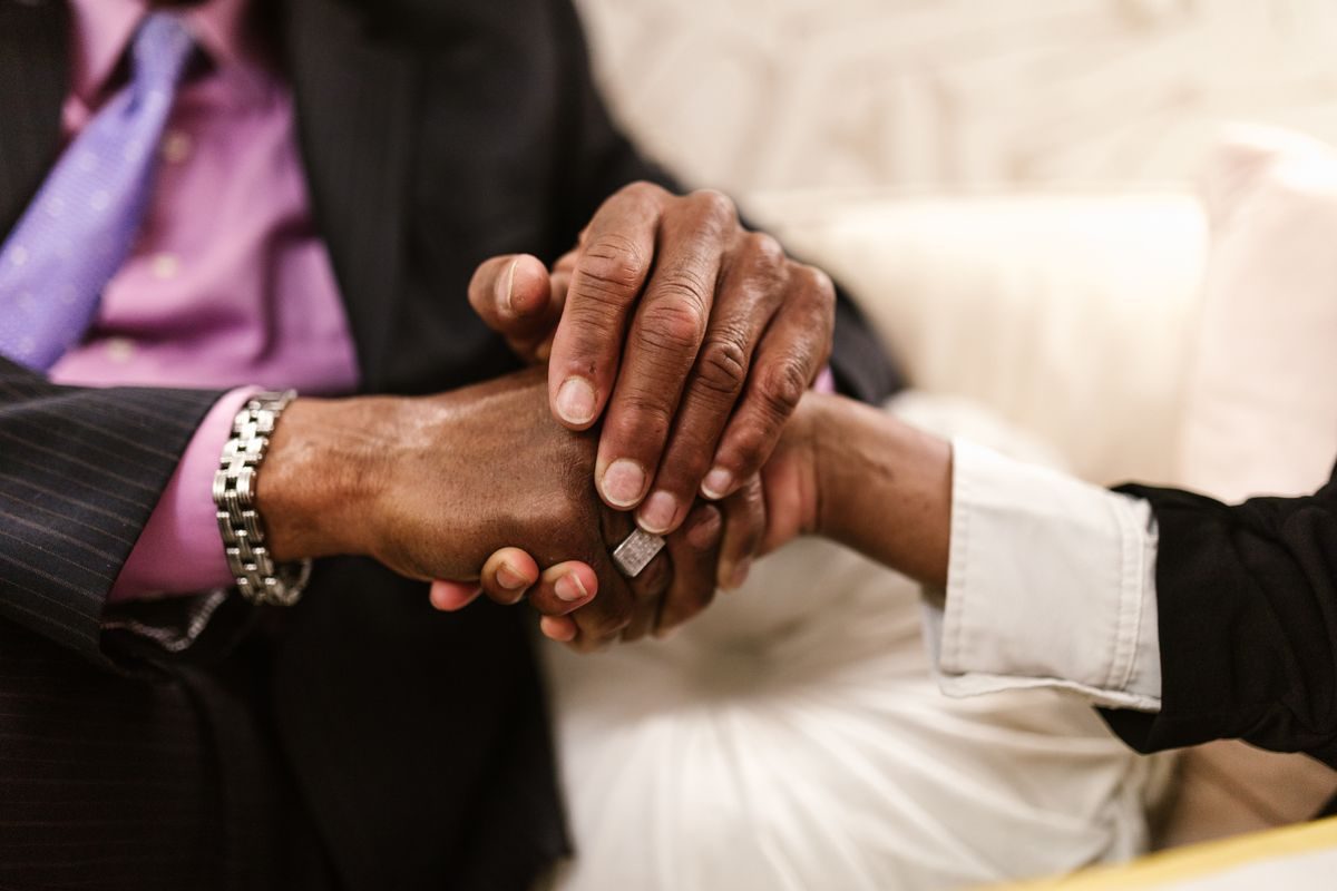 Two people clasping hands